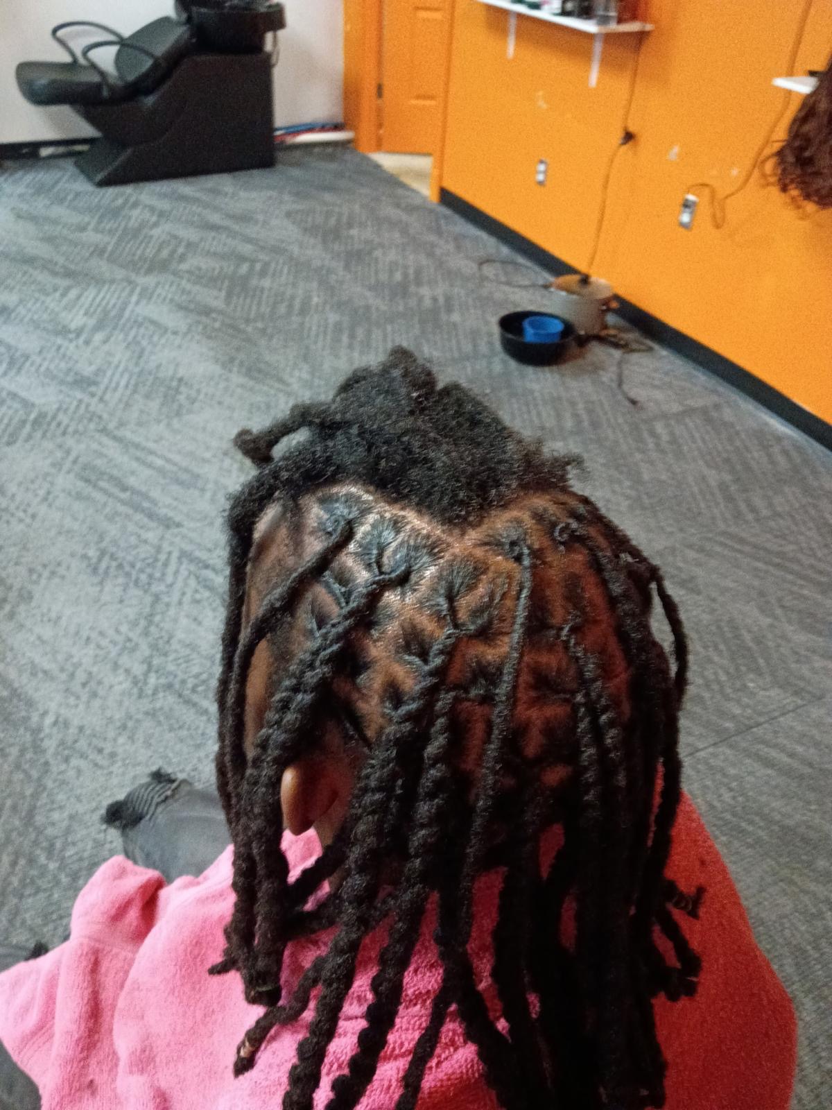 Braiding style by Chidalu African Braids
